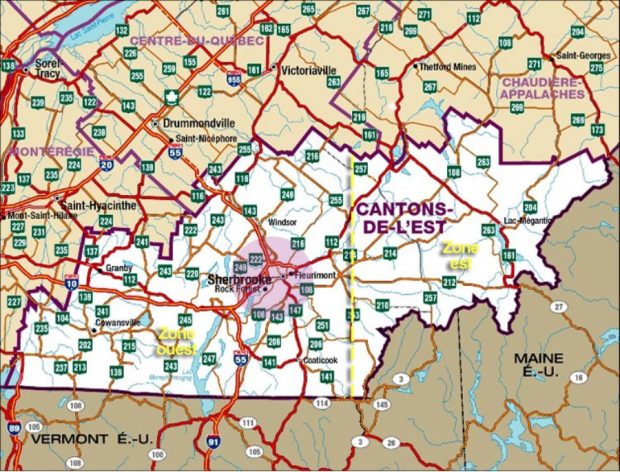 Colour photograph of a map of the Eastern Townships with surrounding Quebec regions and American states.