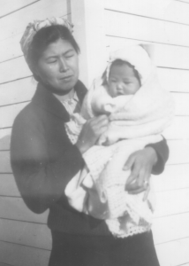 Hattie Tanouye holding her baby