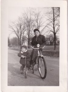 Young Japanese boy and young Japanese girl on bikes