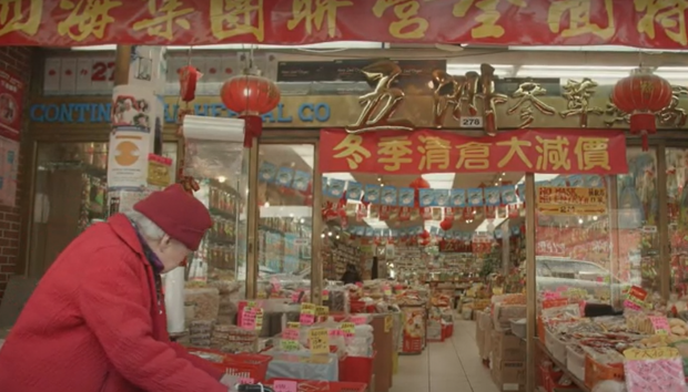 Chinese storefront with elderly person looking at goods