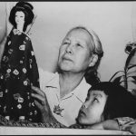 Japanese woman and girl with a Japanese doll