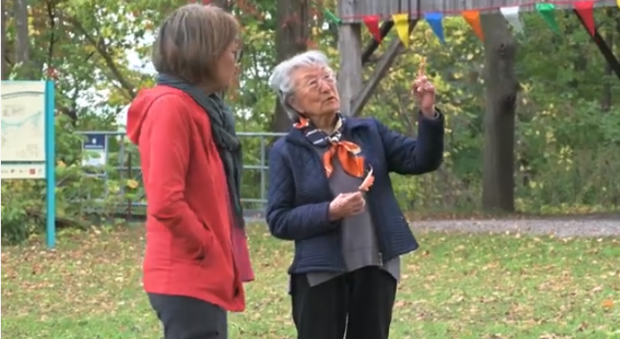 Addie and Lynn Kobayashi standing outside talking