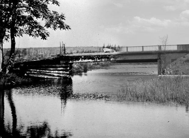 On the left a black and white photograph of a wooden bridge, on the right a contemporary image of a concrete bridge.