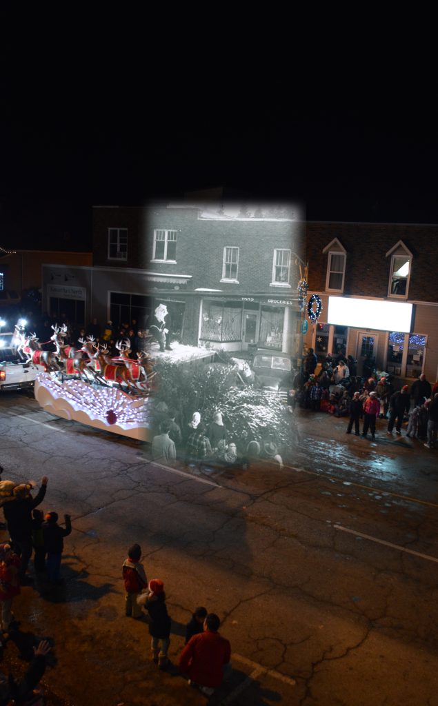 A contemporary photograph of a Christmas parade; a black and white picture of Santa Claus superimposed