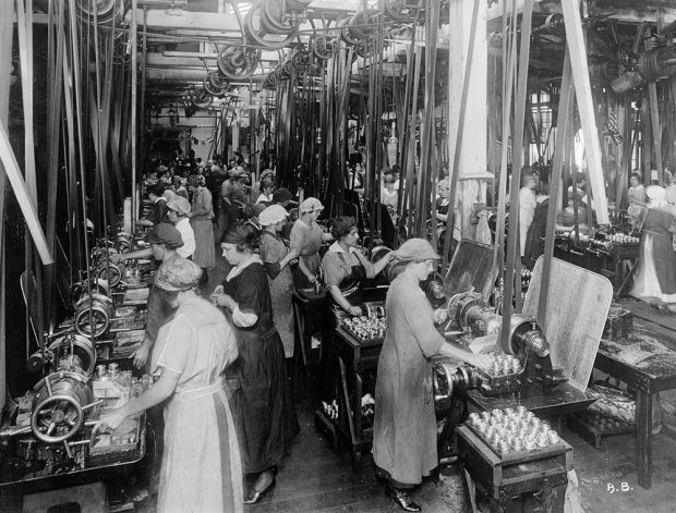 Black and white image of women working in a thread factory.