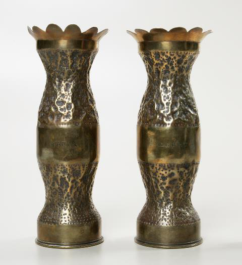 Two brass vases. One is engraved with Albert and the other is engraves with Ypres.