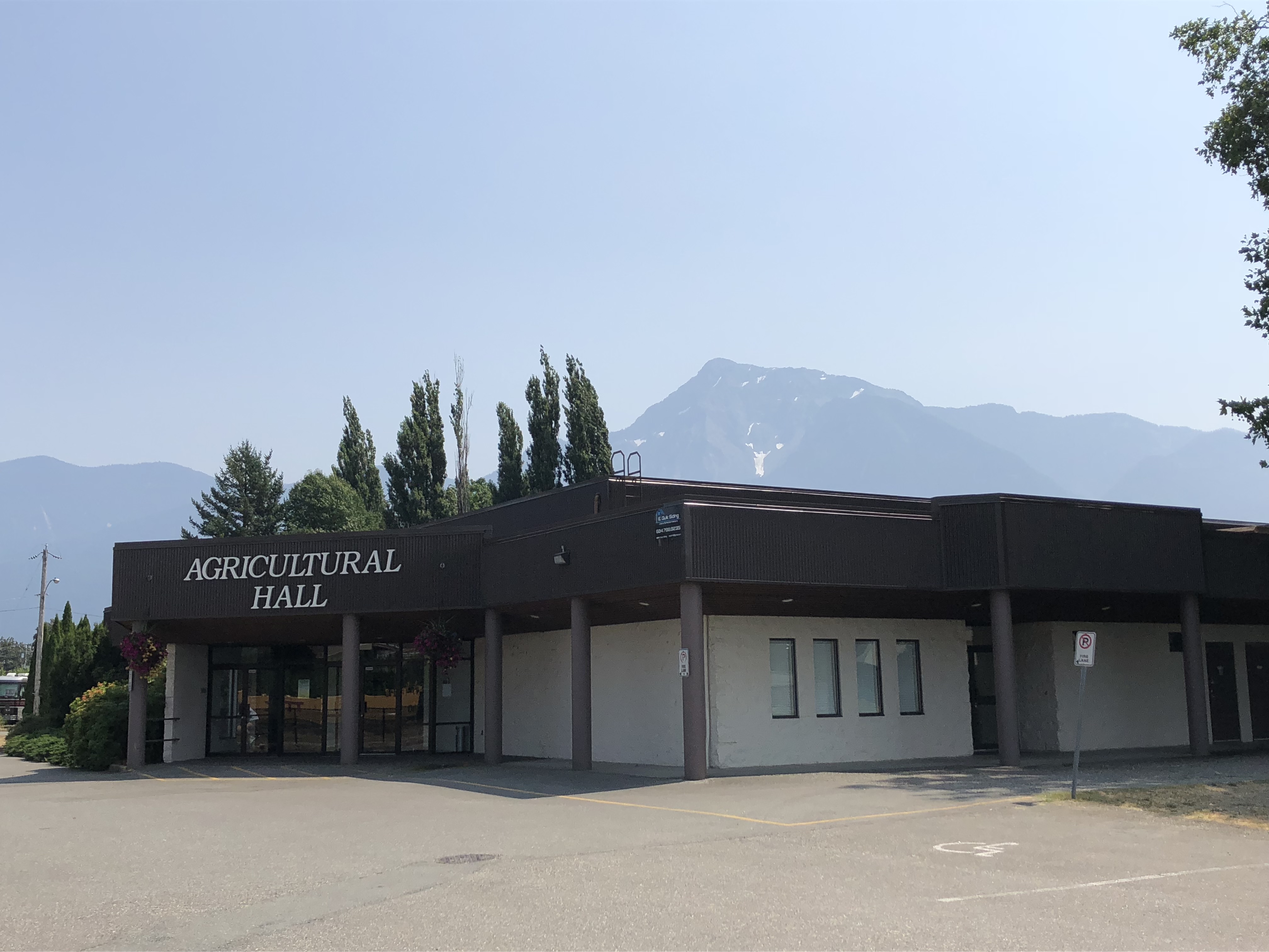 Colour photograph of the Agricultural Hall building and parking lot.