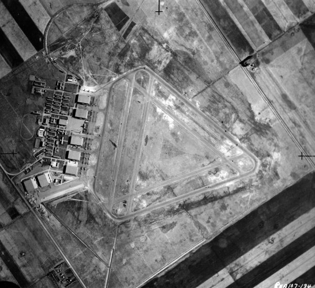 black and white aerial view of airport and buildings