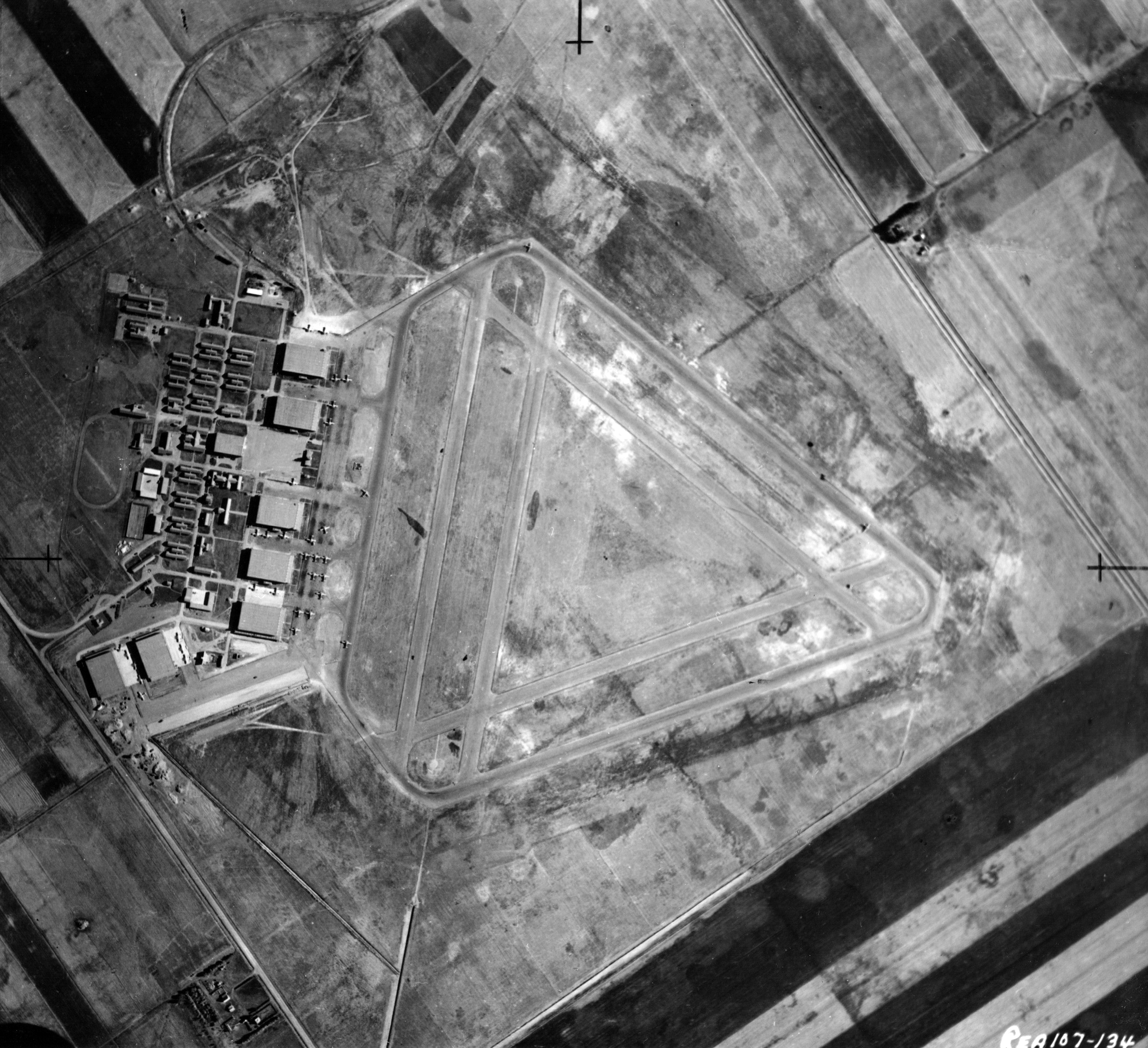 black and white aerial view of airport and buildings