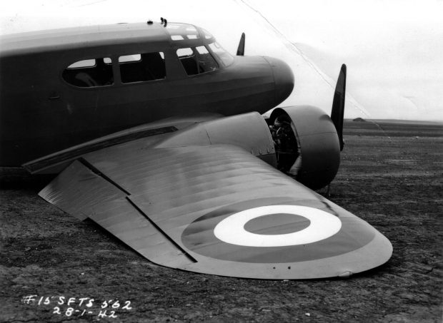 airplane on ground with broken engine cowling