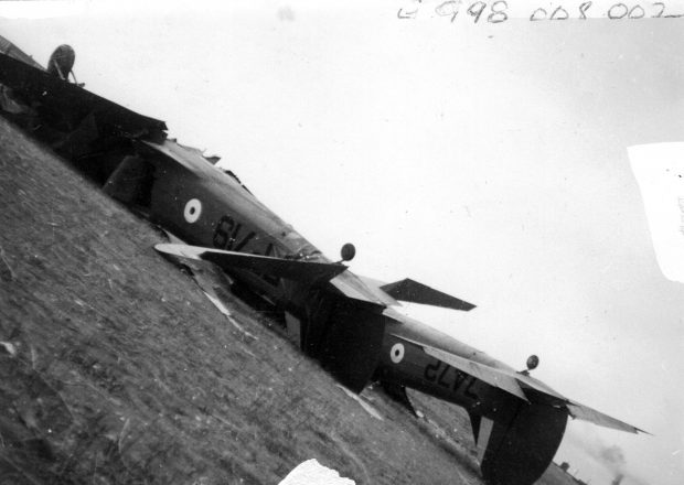 Two airplanes upside down on the ground