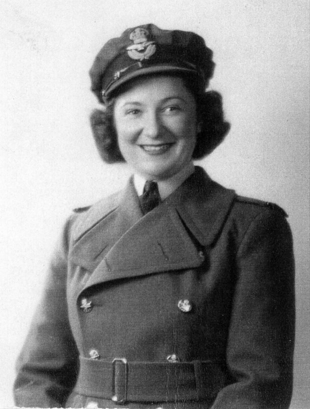 woman in military coat and hat