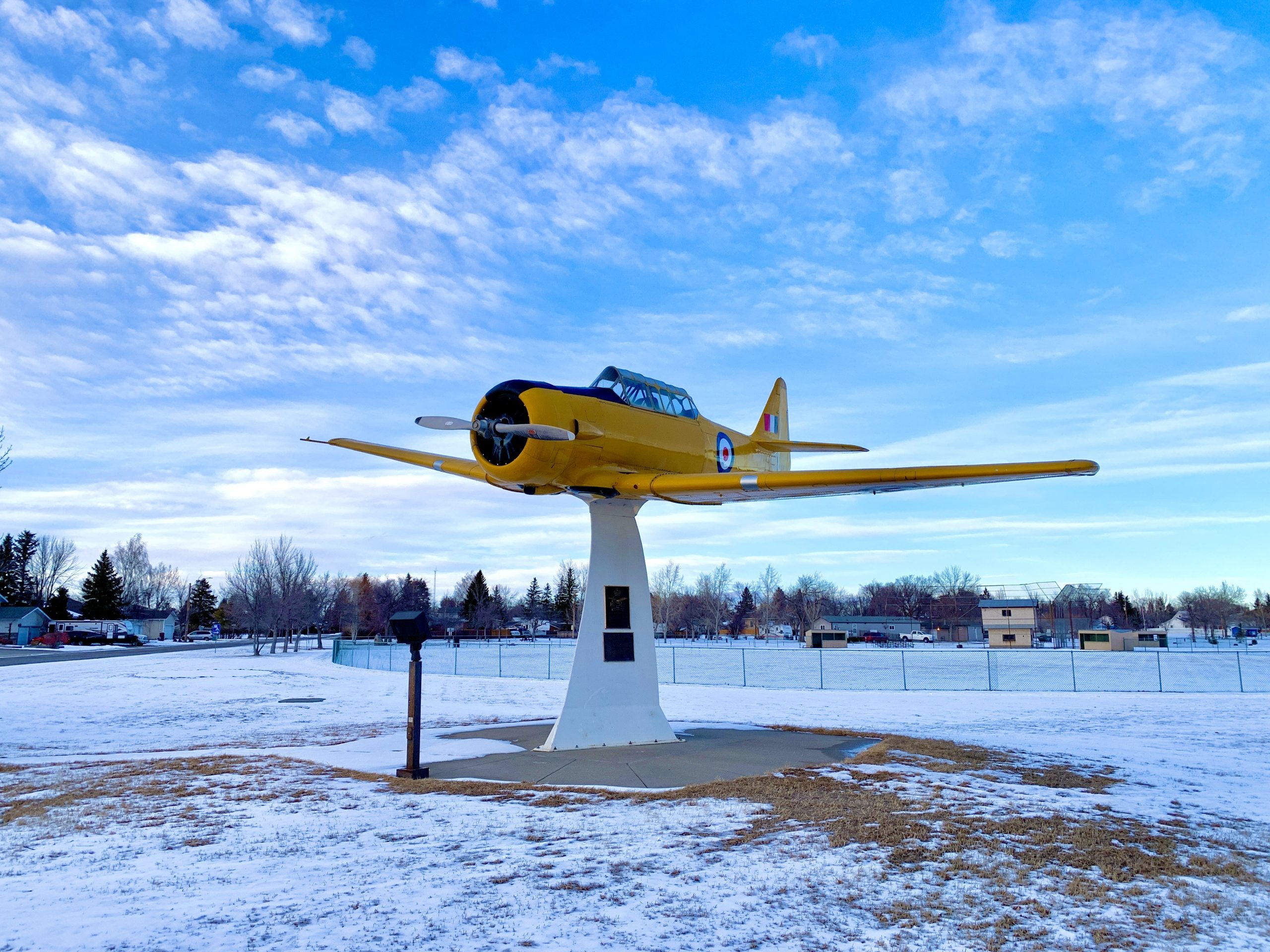yellow plane on pedestal