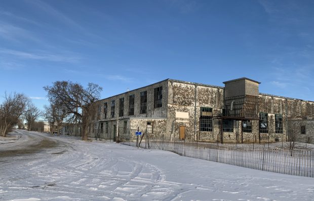 fold airplane hangar with snow on ground