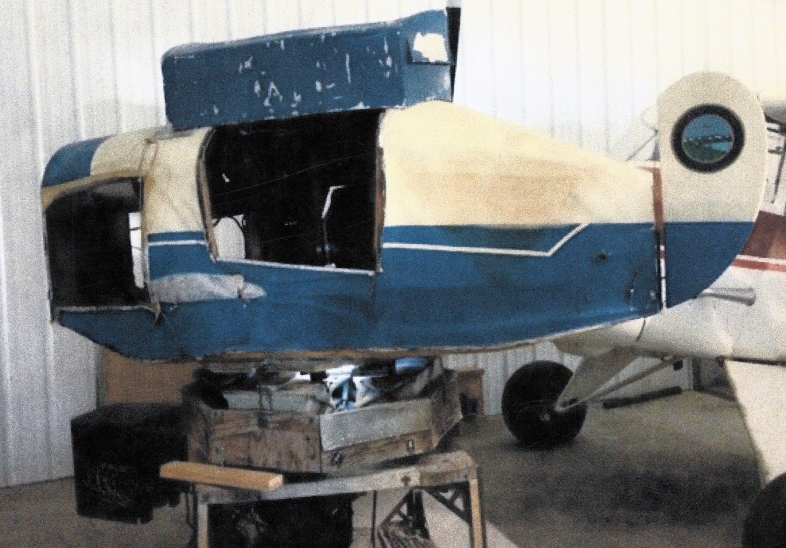 blue and white Link trainer model airplane