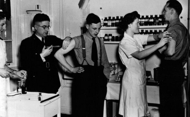 two men and two women in doctors office