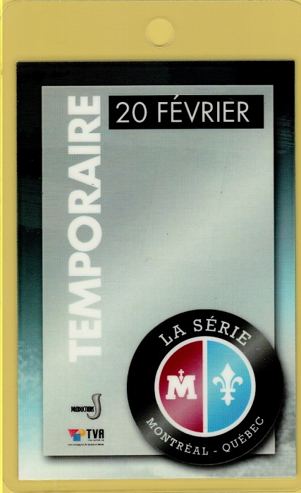 Colour photo of a pass on which appear the word Temporaire, a date, the logo for the event and two logos of production companies.