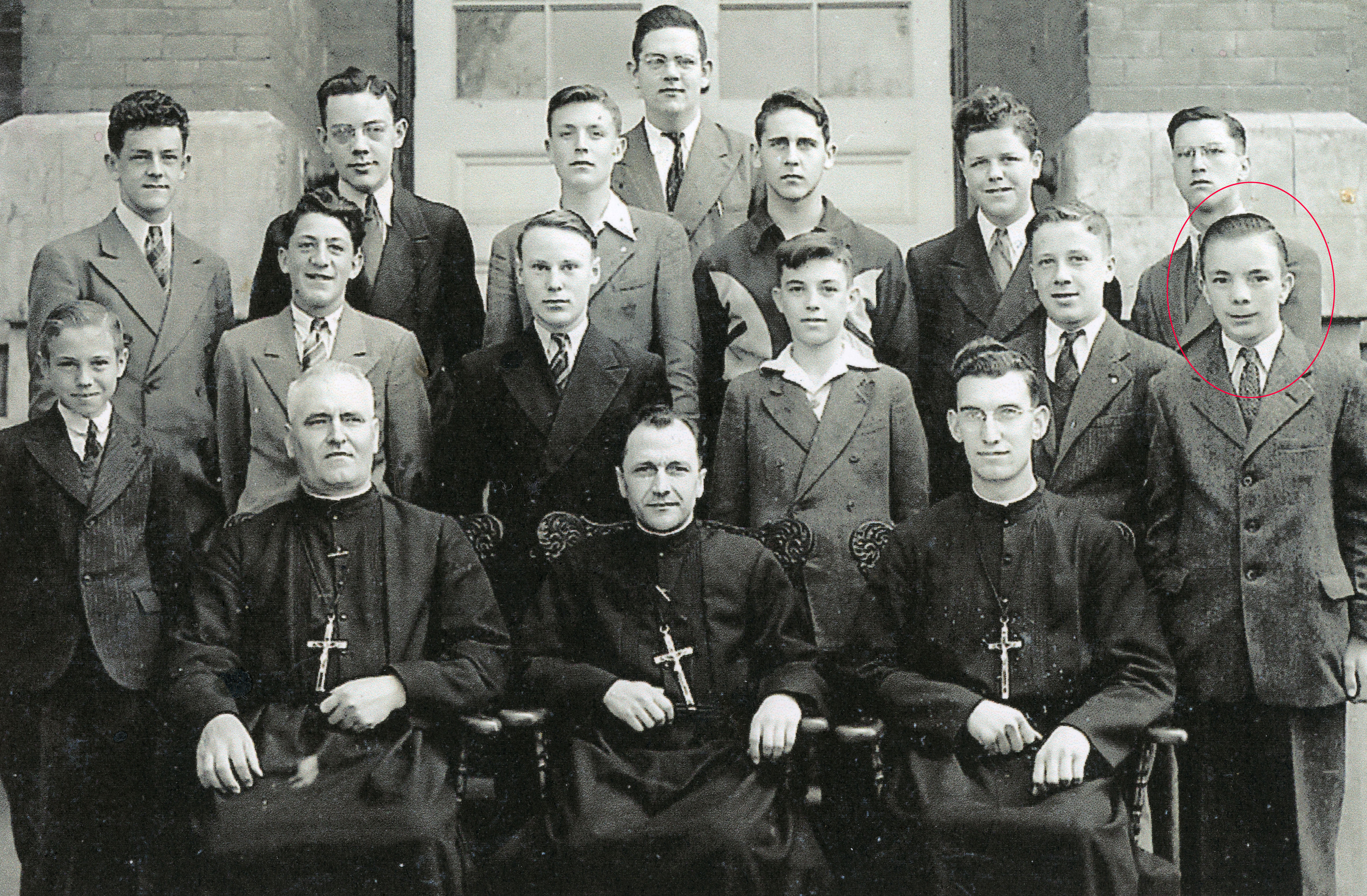 Class photo, 13 young men and 3 priests