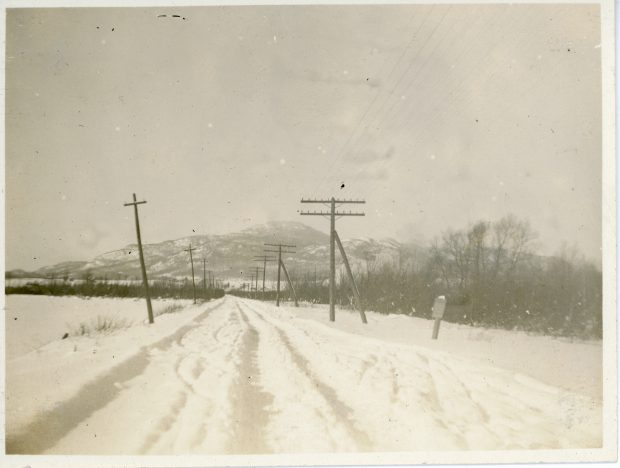 A snow-covered country road