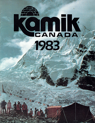 The picture shows the cover page of the Kamik boots 1983 promotional catalog. We see people assembled at a base camp at the foot of Mount Everest.