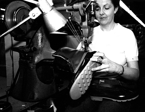 In this picture, we see operator Lucie Berthiaume working on a Puritan, three-needle sewing machine. She is crafting a Kamik winter boot.