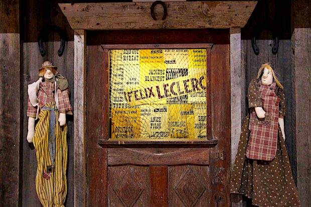 Color photo of the Butte ticket office and two puppets at the 2021 exhibition.