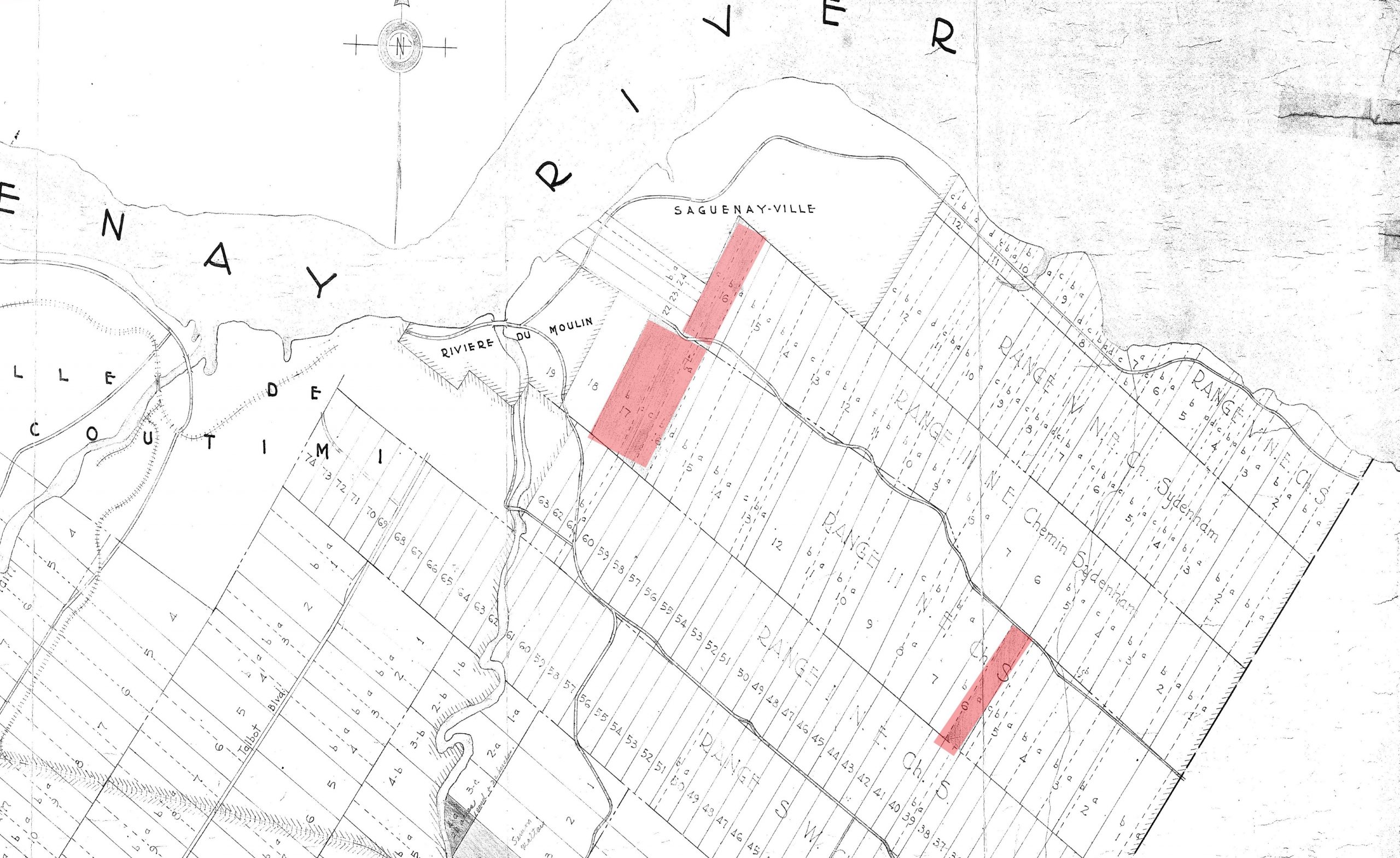 Black and white drawing of land parcels with some sections in red.
