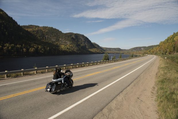 Colour photo, route 155 winds along the Saint-Maurice River.