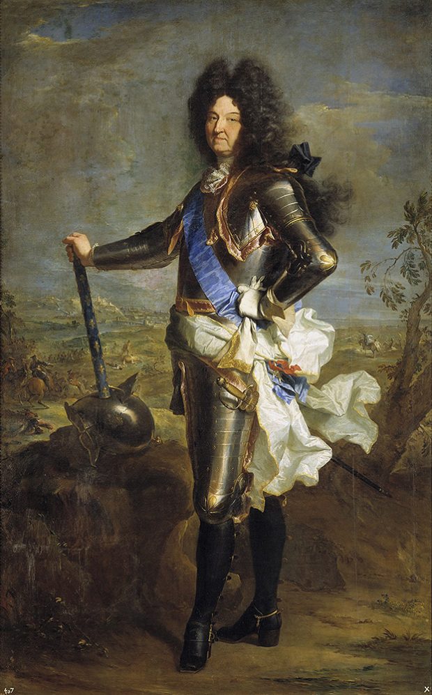Painting representing the king of France Louis XIV. He is standing in armor in front of a battle scene. He has one hand on his hip and the other is holding a weapon.