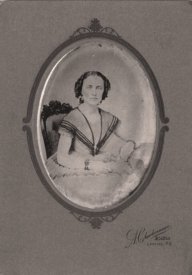 Black and white inset picture of Philomène Dalton around the age of 20.