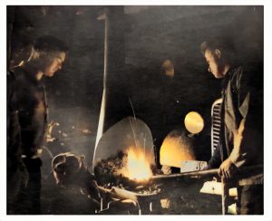 Two men at a forge