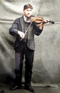 Standing man playing a violin