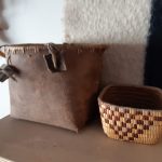 Two first Nations baskets on a shelf
