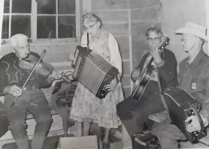 Four musicians paying in a hall.