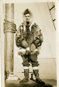 Man in Inuit clothing on board a ship