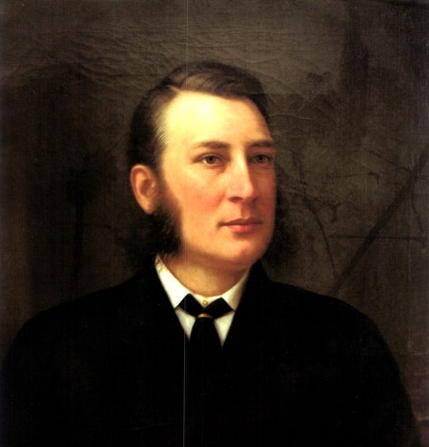 A head-and-shoulders oil painting of James Coristine, wearing a black coat and cravat, white collar and shirt. He looks to be between the ages of 30-40, with side-parted dark hair, and long sideburns. His expression is calm, though his complexion is flushed; he gazes into the distance to the right of the viewer.