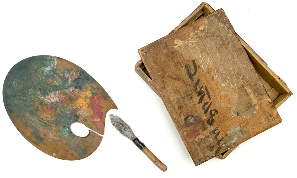 Artist's palette, artist's paint knife, and artist's paint box.
