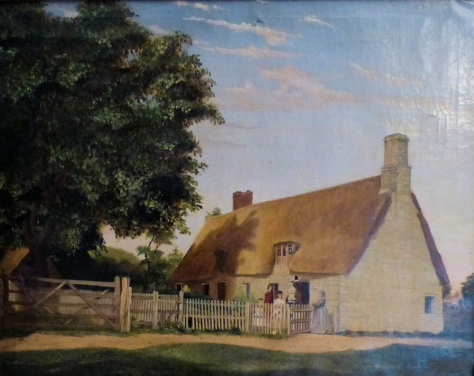 Landscape featuring thatched roof cottage behind fence