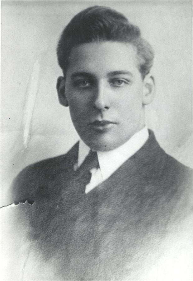 Black and white archival photograph of a man in a suit and tie.