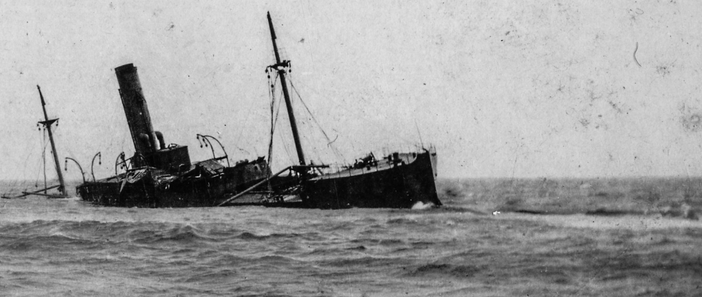 Black and white archival photograph of large passenger liner ship, the SS Florizel, run aground in ocean.