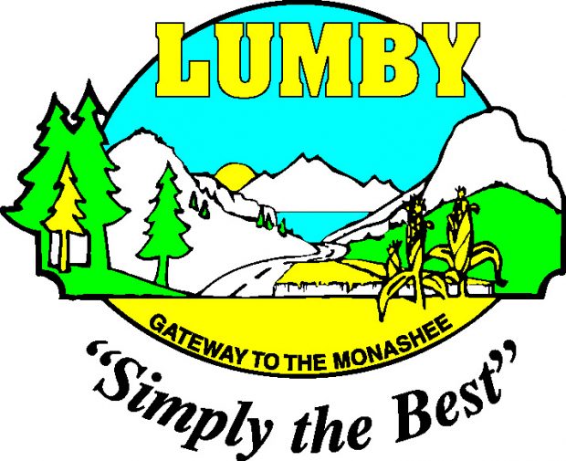 A logo displays a mountain in the background with a lake. In the foreground there are trees and corn stalks. The logo displays the words: Lumby, Gateway to the Monashee, Simply the Best.