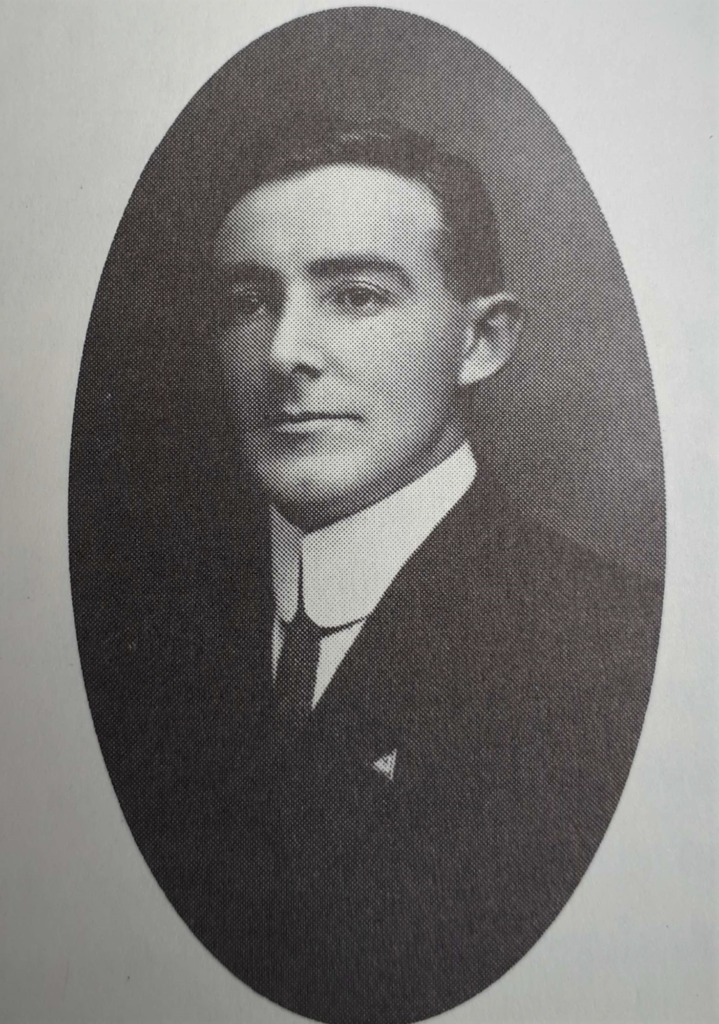Portrait of young man wearing a jacket and tie.