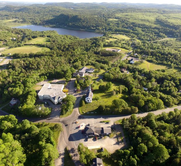 An aerial view of Kingston. On left side is school today showing large 1981 additions.