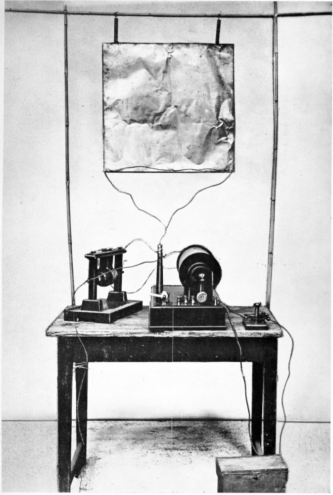 A small table with radio equipment and wires.