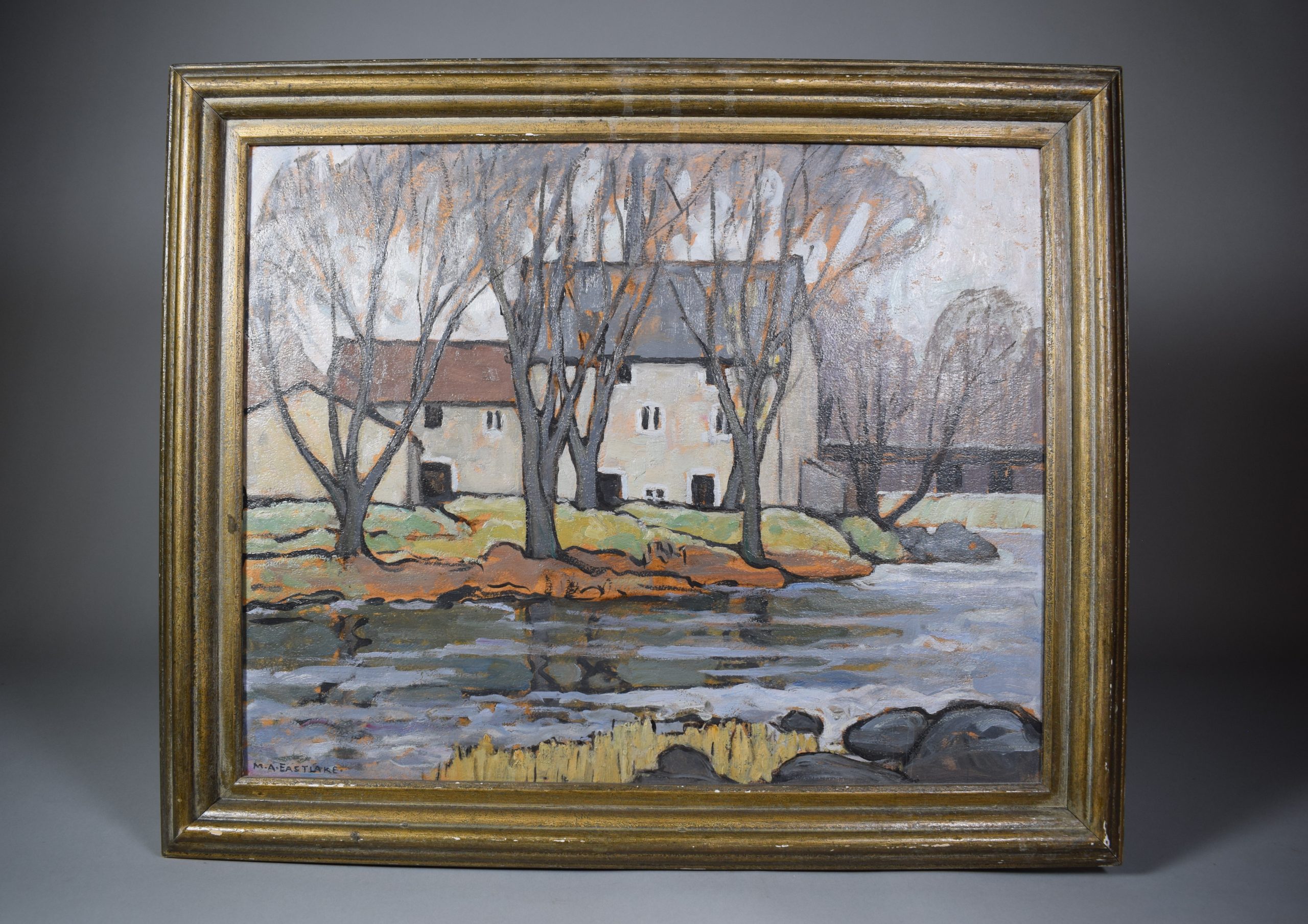 Colour oil painting of a mill on the banks of a river in the fall. It shows the river, trees and the mill. A low gabled building is seen from the back, next to which is the mill in two sections. The first section, on the left, has two floors of grey stone and a rusty gabled roof. The second section, on the right and attached to the first, has three floors and a dark grey gable roof. Behind the mill is a waterfall, a black railway bridge and more trees.
