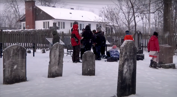 Student group in a cemetery in winter.