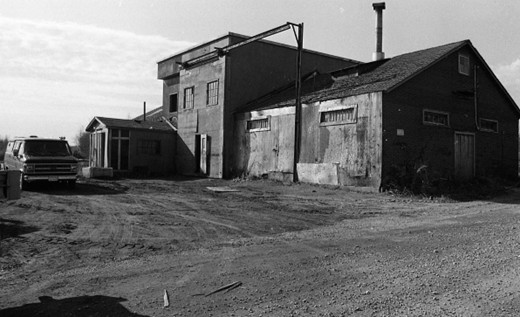 Black and white photograph showing the exterior of the Red Mill plant in Sainte-Marthe-du-Cap.