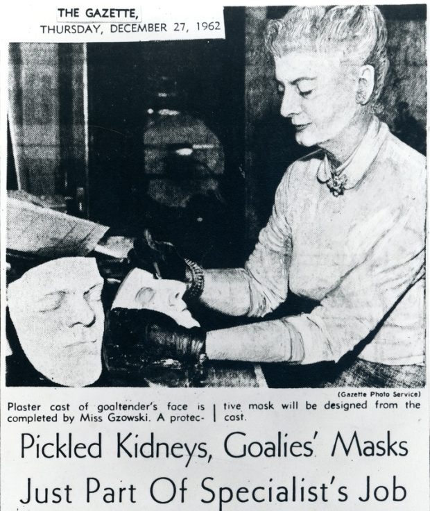 Black and white newspaper article titled, Pickled Kidneys, Goalies' Masks Just Part of Specialist's Job. Contains photo of Mary Gzowski working on medical moulages of the face.