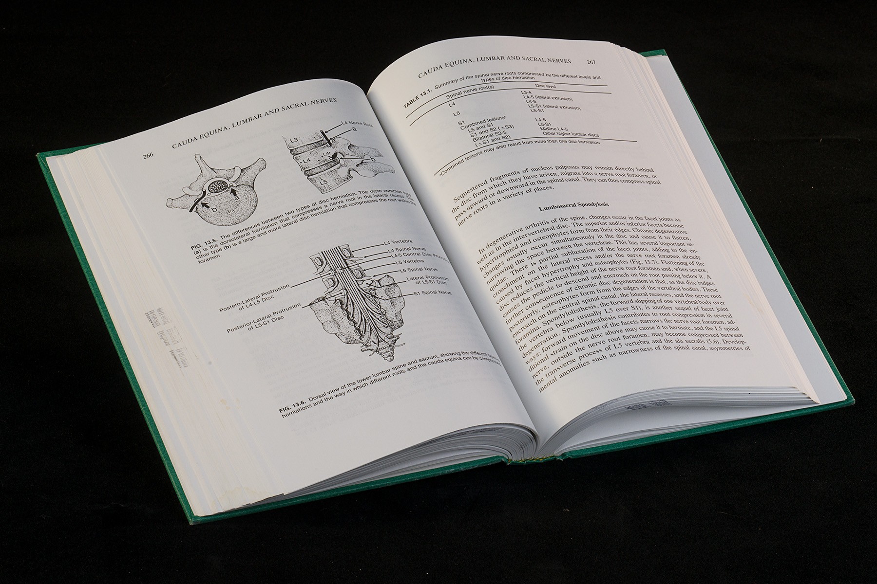 Colour photo of an open book containing medical illustrations and text.