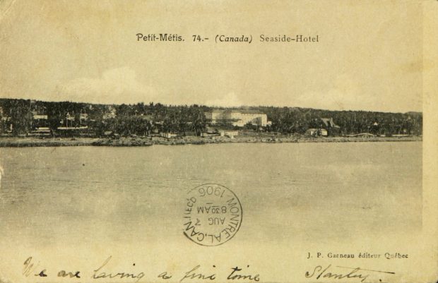 Postcard featuring a black and white photograph taken from the St. Lawrence rRiiver showing summer residences and the Seaside Hotel built along Beach Drive Street along the St. Lawrence River.